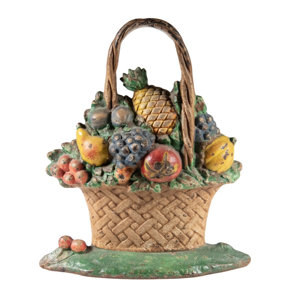 HUBLEY CAST IRON FRUIT BASKET DOOR STOP: Basket with Hoop Handle, overflowing with fruit, pineapple at top. Original paint. OS: 11 1/2 x 10 x 2 in. (29.2 x 25.4 x 5.1 cm.)