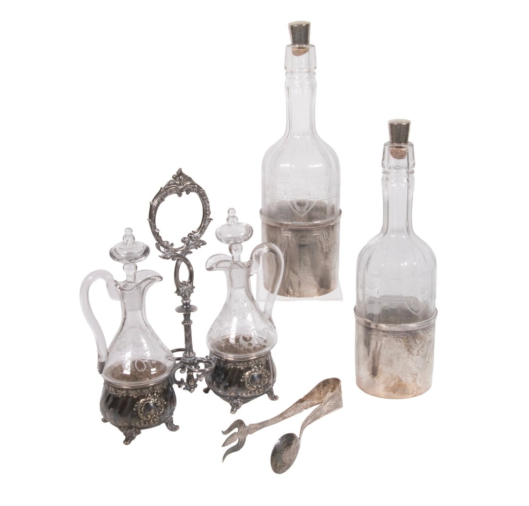 (4PC) SILVER AND SILVER-PLATED TABLE ITEMS: Including a German WMF silver-plated cruet stand with two etched glass bottles; together with a pair of etched glass wine bottles fitted with STERLING mounts marked “BRAND–HIER