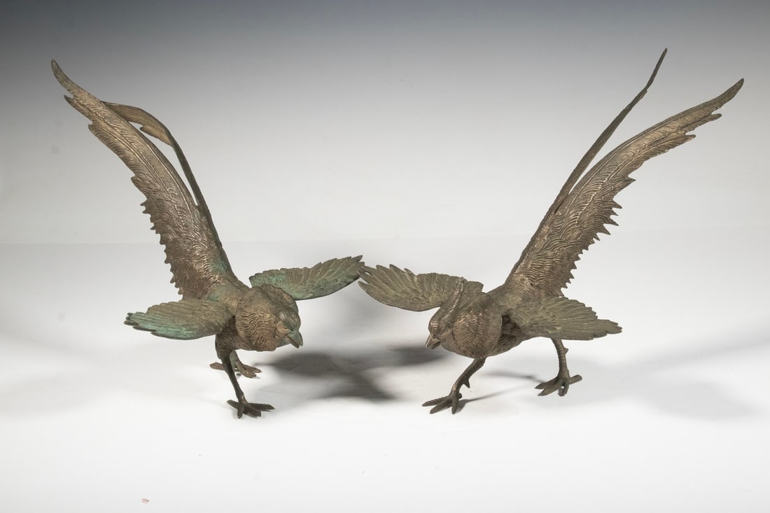 PR BRONZE PHEASANTS: Pair of Vintage Centerpiece Gamebirds, mid-20th c., depicting male and female pheasants. Missing back toe to one figure.Each OS: 10 1/4 x 14 x 10 in. (26 x 35.6 x 25.4 cm.)