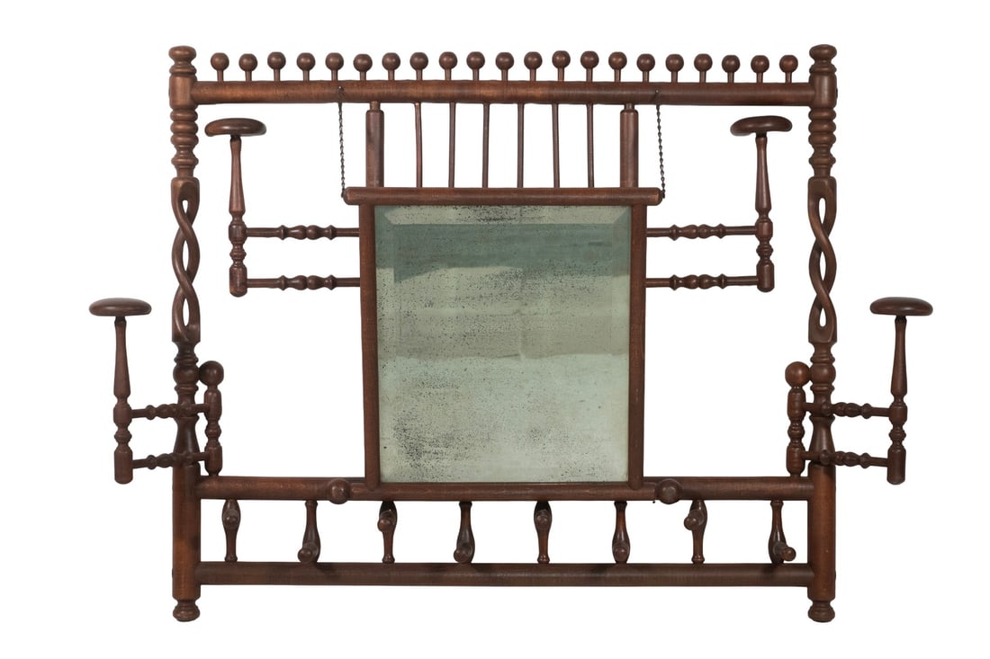 CIRCA 1900 STICK AND BALL WALL HANGING HAT RACK W/ MIRROR: Red Walnut with four pivoting mushroom top hat rests, six pivot pegs at bottom, hinged tilt-out mirror with chain stops at center. OS: 27 x 32 in. (68.6 x 81.3 cm.)
