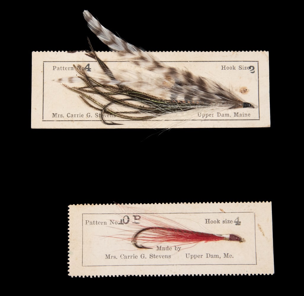 (2) FISHING HANDTIED DRY FLIES BY CARRIE G. STEVENS, UPPER DAM, MAINE: No. 4, hook size 2 & No. 10P, hook size 4. With original cards, No. 4 detached.