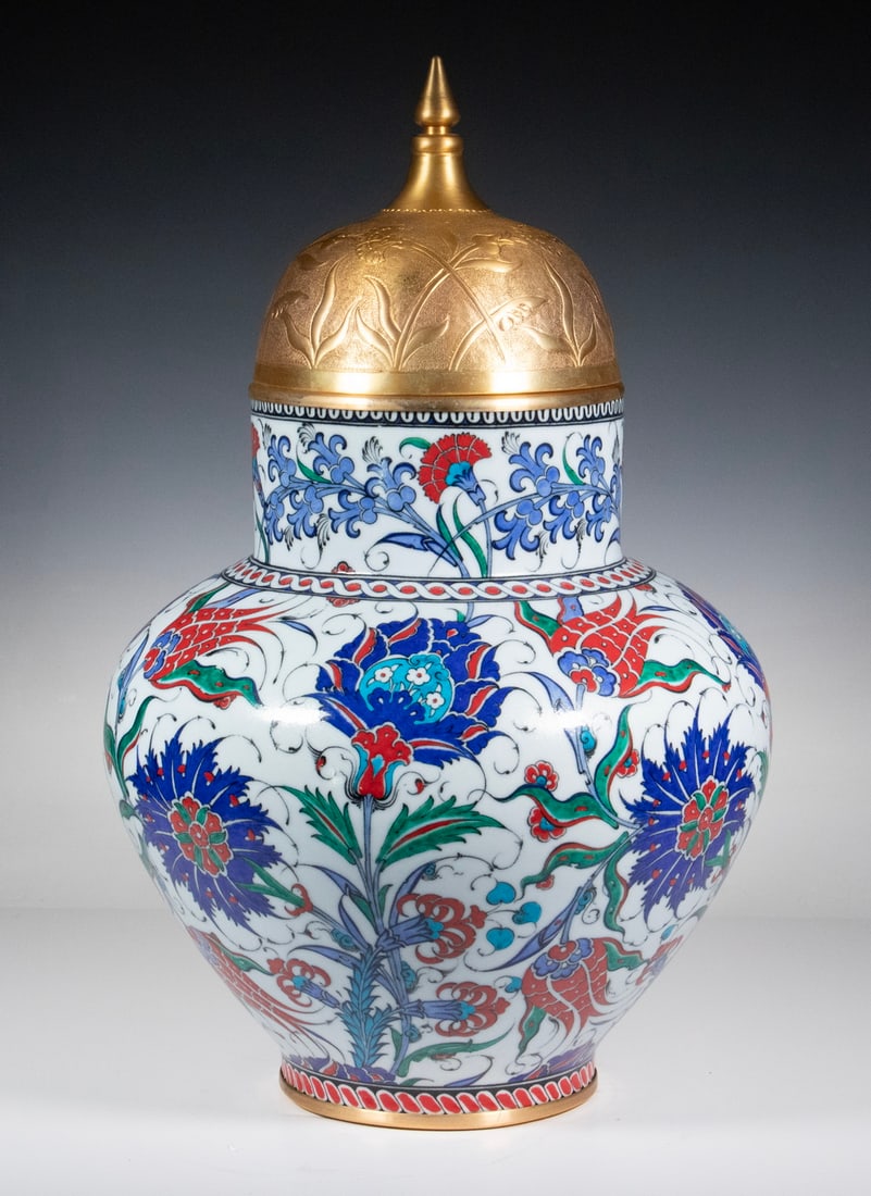 IZNIK DESIGN JAR WITH TOMBAK BY ADNAN HOCA ERGULER: Turkish Glazed Pottery Covered Jar with gilt metal mounts and lid, with tulips, carnations and hyancinths decoration inspired by 16th c. Iznik motifs, by master ceramic artist Adnan Hoca Erguler (d.