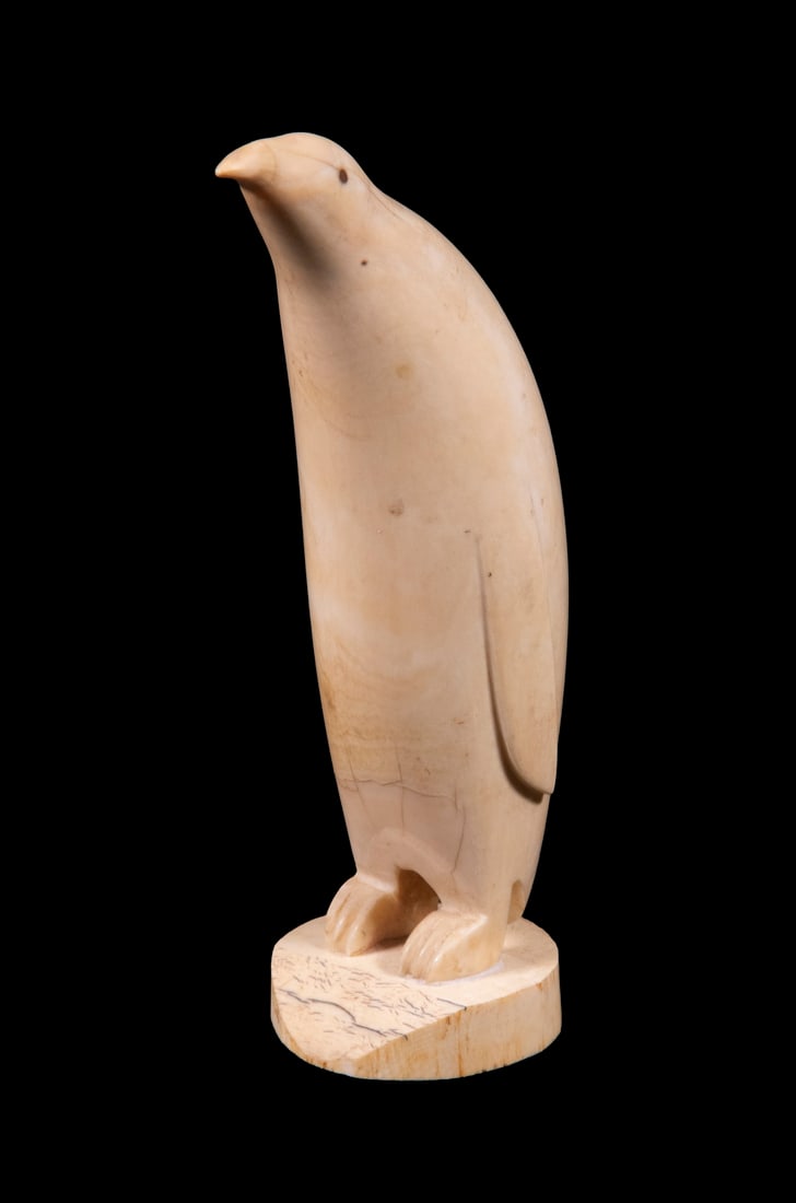 TLINGIT ESKIMO WALRUS TUSK CARVING: Early 20th century figure of a Standing Penguin, unsigned. Height: 7 in. (17.8 cm.)