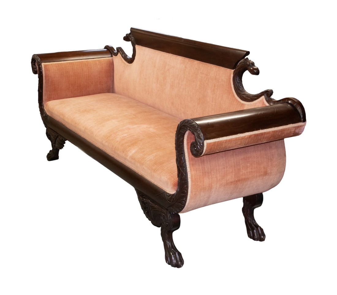 EMPIRE PERIOD MAHOGANY SOFA: Circa 1825 Sofa, with carved eagle head back, scrolled arms with carved acanthus leaves, velvet upholstery, the front legs topped with rosettes and feathers and set on paw form feet.38 1/2 x 96 x 24