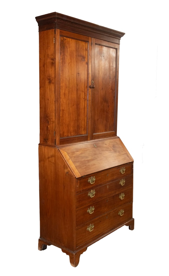 VIRGINIA CHIPPENDALE WALNUT SECRETARY DESK: Circa 1790 Two Part Secretary. The top section with dentil molded cornice above two paneled doors with three interior shelves. The lower section consisting of a fall front desk (with lid key) with fit