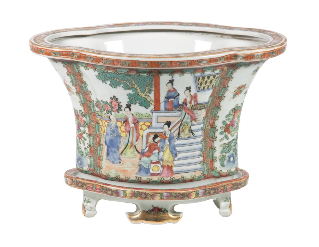 CHINESE FAMILLE ROSE PORCELAIN JARDINIERE WITH FITTED STAND: A vintage flared porcelain jardiniere finely enameled in famille rose palette with court ladies in a garden setting, framed by scrolling lotus bands and peach borders. The vessel is accompanied by a m