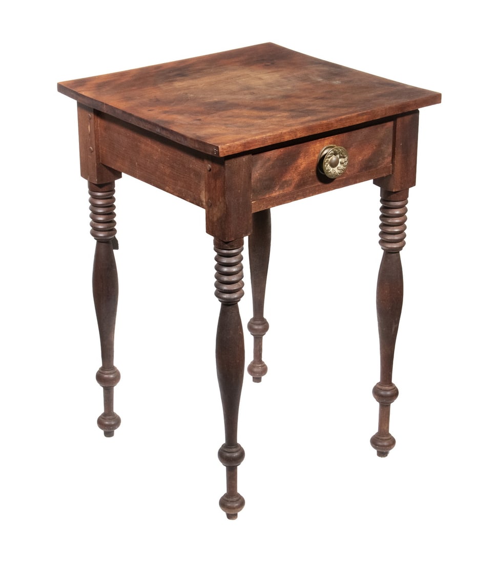 C.F. SPEAR SHERATON LAMP STAND FROM BRAINTREE, MASS. DATED 1839: Figured Walnut, with lively overhanging top, single drawer with pressed brass knob, ring and ball bowed legs, inscribed in pencil on the underside of the drawer: "C.F. Spear, Braintree, March 16, 1839