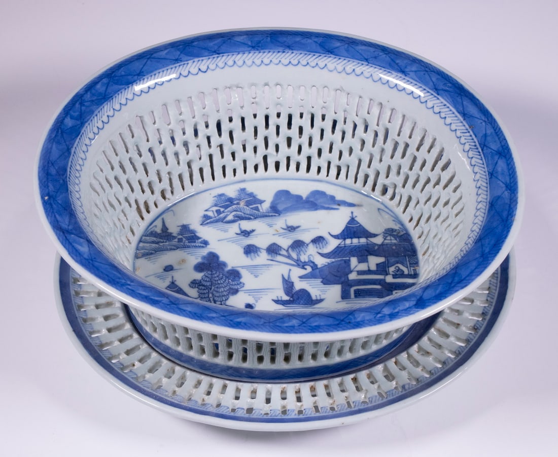 CHINESE EXPORT CANTON CHESTNUT BASKET & PLATE: 19th c. Blue & White Porcelain Oval Reticulated Bowl, with matching underplate.Bowl: 4 x 10 3/4 x 9 1/2 in. (10.2 x 27.3 x 24.1 cm.), Underplate: 11 x 9 1/2 x 9 1/2 in. (27.9 x 24.1 x 24.1 cm.)