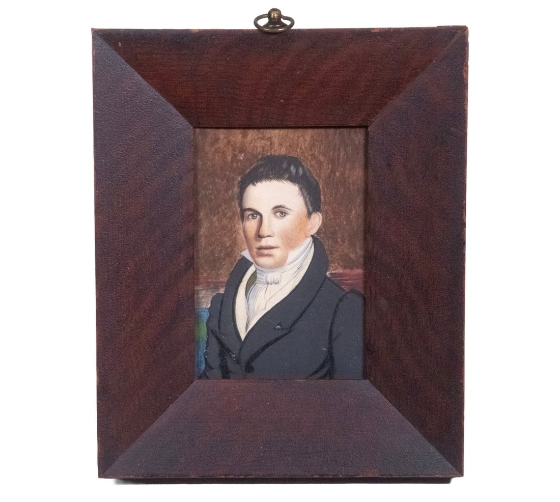 EARLY 19TH C. MAINE MINIATURE PORTRAIT: Portrait of a Young Man with black hair, circa 1835, gouache on card, unsigned, in grain painted mitered frame. Sitter is identified on back of card as "T.J. Perkins, Perkin's Ridge, PO West Auburn,