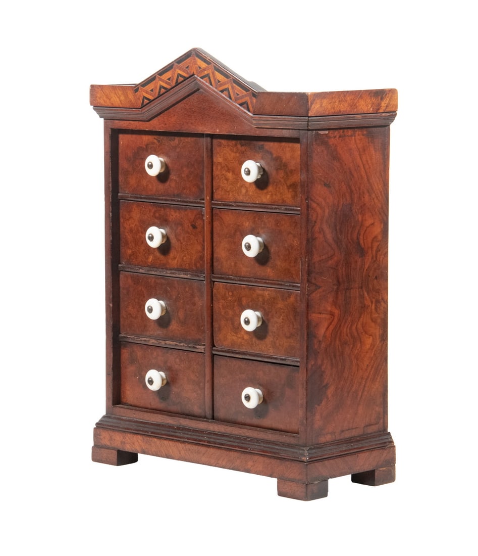 BURL WALNUT 8-DRAWER SPICE CHEST: 19th c. Wall Hanging Inlaid Spice Cabinet, having a shaped molded edge and parquetry inlaid cornice, above eight drawers with porcelain pulls, set on a bracket base, with hanging loops affixed to