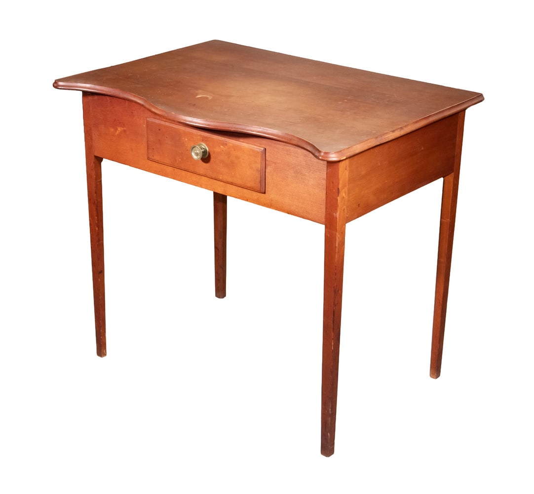 CHERRY SERPENTINE SERVING TABLE: Country Hepplewhite Server or Writing Table, early 19th c., with molded edge serpentine top, conforming frieze with single front drawer, set on square tapered legs. 30 1/2 x 33 1/2 x 24 in. (77.5 x 85