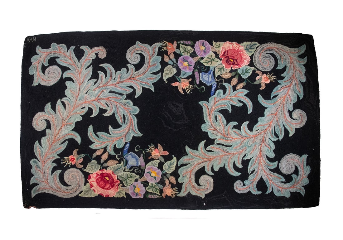 HOOKED RUG FLORAL ON BLACK DATED 1969: Blossoms and Scrolled Leaves on black field, initialed "MVH, 69" by Myrtle Vivian Higgins of Massachusetts.Size: 37 x 65 in. (94 x 165.1 cm.)