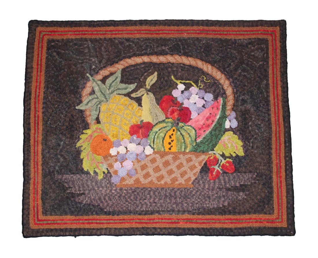 FRUIT THEOREM HOOKED RUG 33" x 40": Handled Basket overflowing with polychrome fruit, including a pineapple, on stippled chocolate field with orange, red and grey striped border.OS: 33 x 40 in. (83.8 x 101.6 cm.)