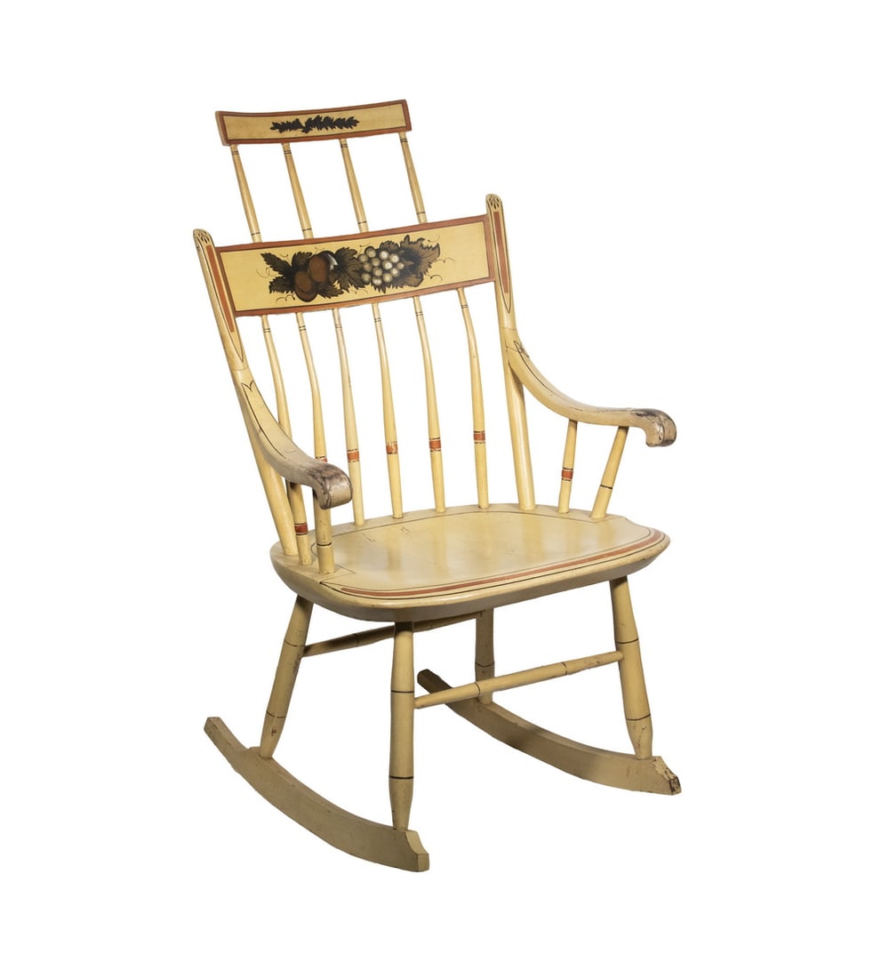 PERIOD PAINTED WINDSOR COMB-BACK ROCKER: Mid-19th New England Stencil Decorated Rocking Chair, with ochre painted surface, stenciled fruit decoration, and black and terracotta painted highlights; having a six-spindle back, curved arms, and