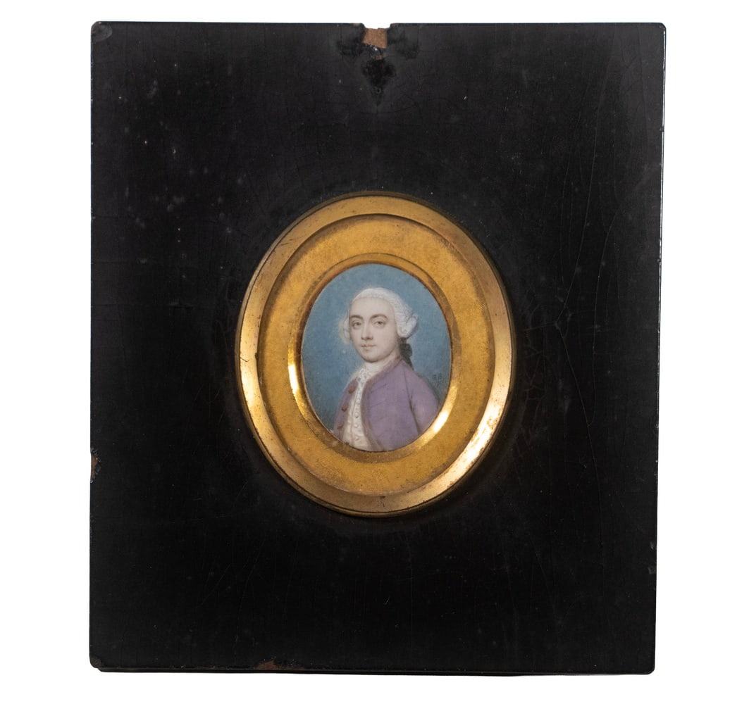 GERVASE JARVIS SPENCER (ENGLAND, C.1715-1763): Miniature Oval Portrait of a Gentleman in lavender waistcoat and powdered wig, watercolor on ivory, initialed an dated 1751, in the original black lacquered panel frame with gilt bezel, domed