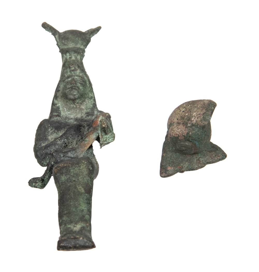 LATE PERIOD EGYPTIAN CAST BRONZE FIGURE PLUS FRAGMENT: Isis Nursing the Child Horus, bronze, reign of Psamtik I, founder of the Saite (26th) Dynasty of Egypt, 664 to 610 BCE, along with an unidentified disassociated piece.Height: 5 1/4 in. (13.3 cm.),