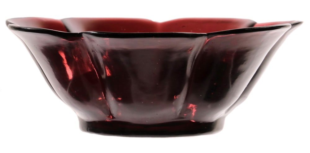 CHINESE PEKING GLASS LOBED BOWL: Amethyst Peking Glass Seven-Lobed Bowl, Qing Dynasty, with everted rim and short foot, unmarked. Bubbles in glass, one tiny rim flake.OS: 2 3/4 x 7 x 7 in. (7 x 17.8 x 17.8 cm.)