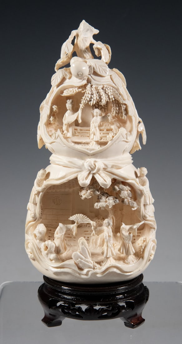 19th C. CHINESE IVORY SCULPTURE: Double Gourd Form, having two deep relief vignettes with full-round figures; the upper, smaller scene having a courting couple in a garden, the larger lower scene with two women dancing to a