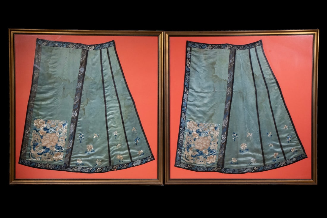 PR CHINESE EMBROIDERED SILK SKIRT PANELS, QING DYNASTY: Each panel showcases intricate embroidery along the borders with auspicious symbols and Buddhist Eight Treasures in blue, cream, and yellow threads. The central celadon blue silk field is delicately o