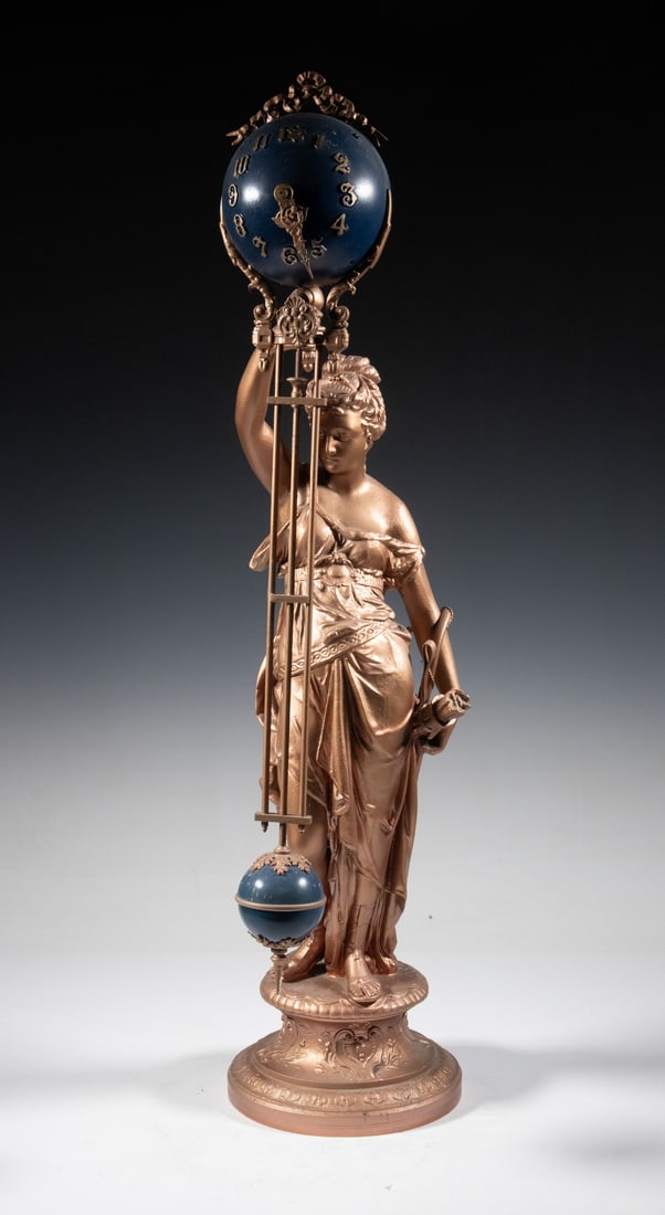 ANSONIA DIANA FIGURAL SWINGING MYSTERY CLOCK: Late 19th c. Shelf Clock, featuring a standing spelter figure of Diana, goddess of the hunt, with bow and quiver of arrows on her left, and her right hand supporting the clock movement and pendulum,