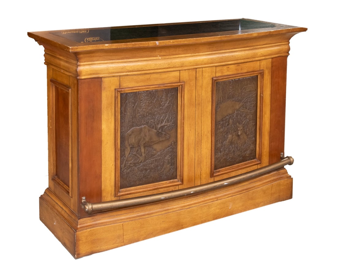 1980'S VINTAGE WALNUT DRY BAR: Bow Front Walnut Bar with inset black marble top, molded inset panes on sides and front, the two on the front having bronze resin reliefs of an Elk and a Wolf's Den, having a conforming brass