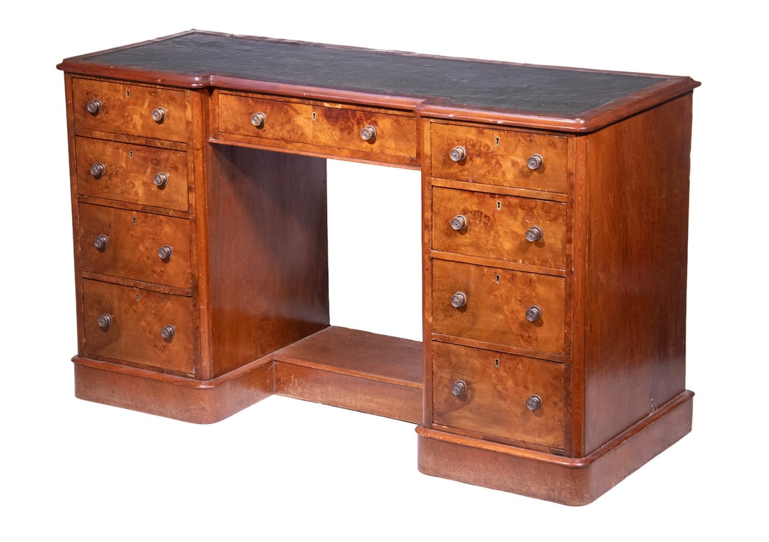 ENGLISH EDWARDIAN BURL KNEEHOLE DESK: Early 20th c. Desk, with burl walnut finish and camphorwood drawer interiors, having a molded edge top with inset green tooled leather writing surface, curved front corners, central shallow drawer