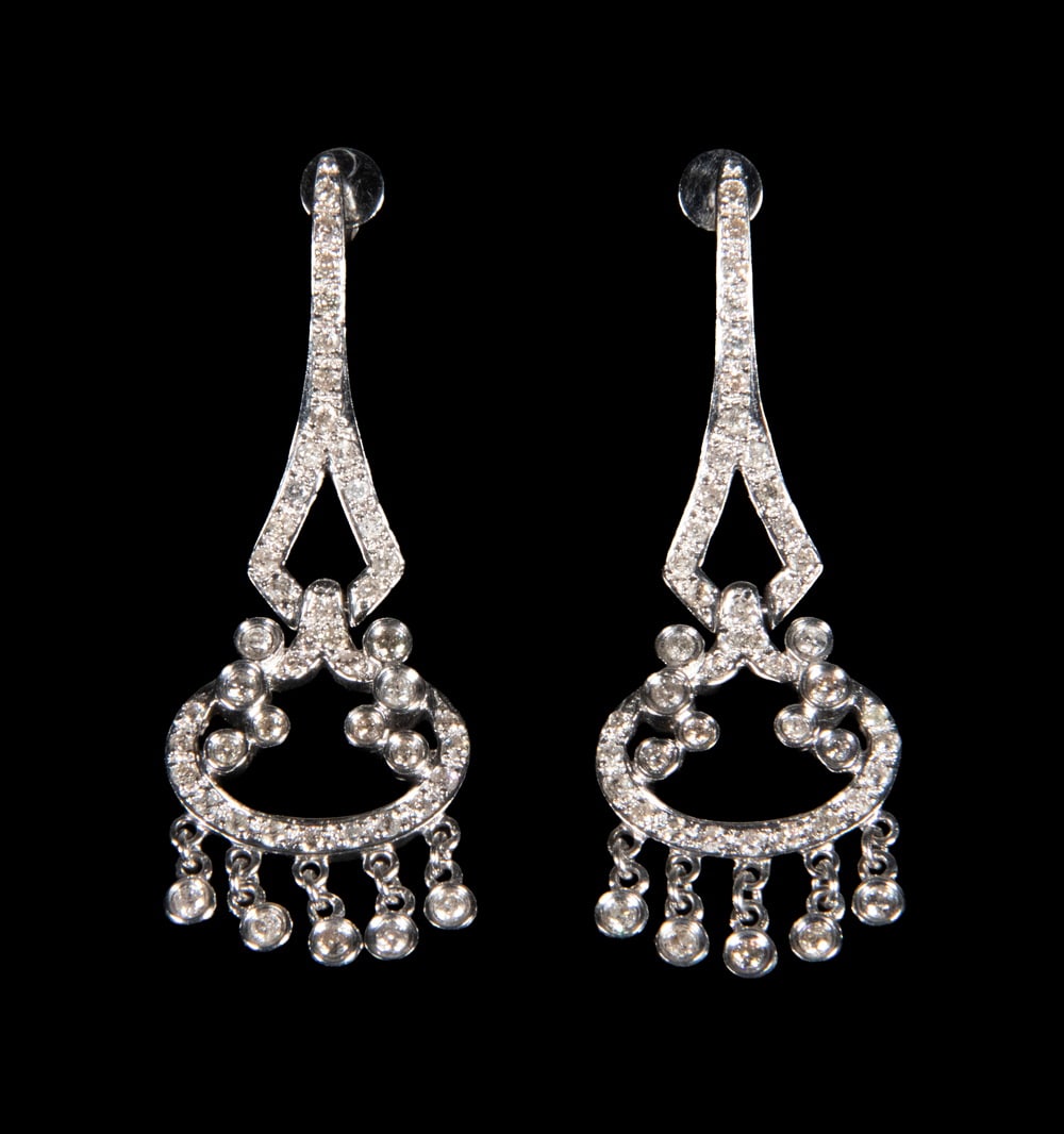 PR 18K WHITE GOLD DIAMOND CHANDELIER EARRINGS: A pair of 18K white gold chandelier-style earrings, each designed with an openwork geometric and circular motif fully set with round brilliant-cut diamonds, suspending delicate articulated drops. Tota