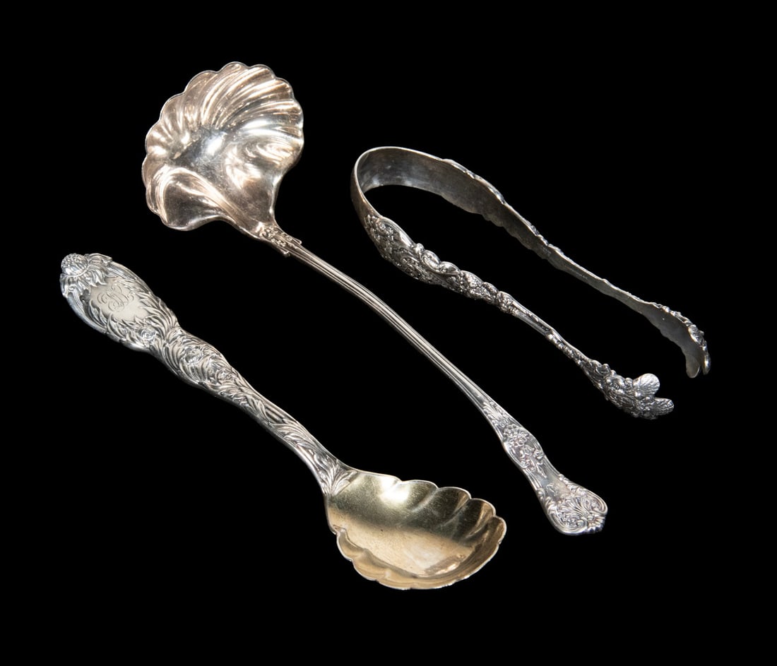 (3 PC) TIFFANY & CO. AND GORHAM SILVER SERVING PIECES: A group of three finely crafted sterling silver serving pieces. Includes a Gorham Versailles pattern sugar tongs with richly cast figural decoration; a Tiffany & Co. Chrysanthemum pattern spoon,