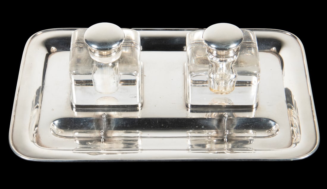 TIFFANY & CO. STERLING DESK STAND WITH INKWELLS: Circa 1920 Art Deco Double Inkwell Set on Fitted Silver Stand, by Tiffany & Co., New York, fitted with a pair of square crystal inkwells with hinged sterling lids, with pen holder to the front,