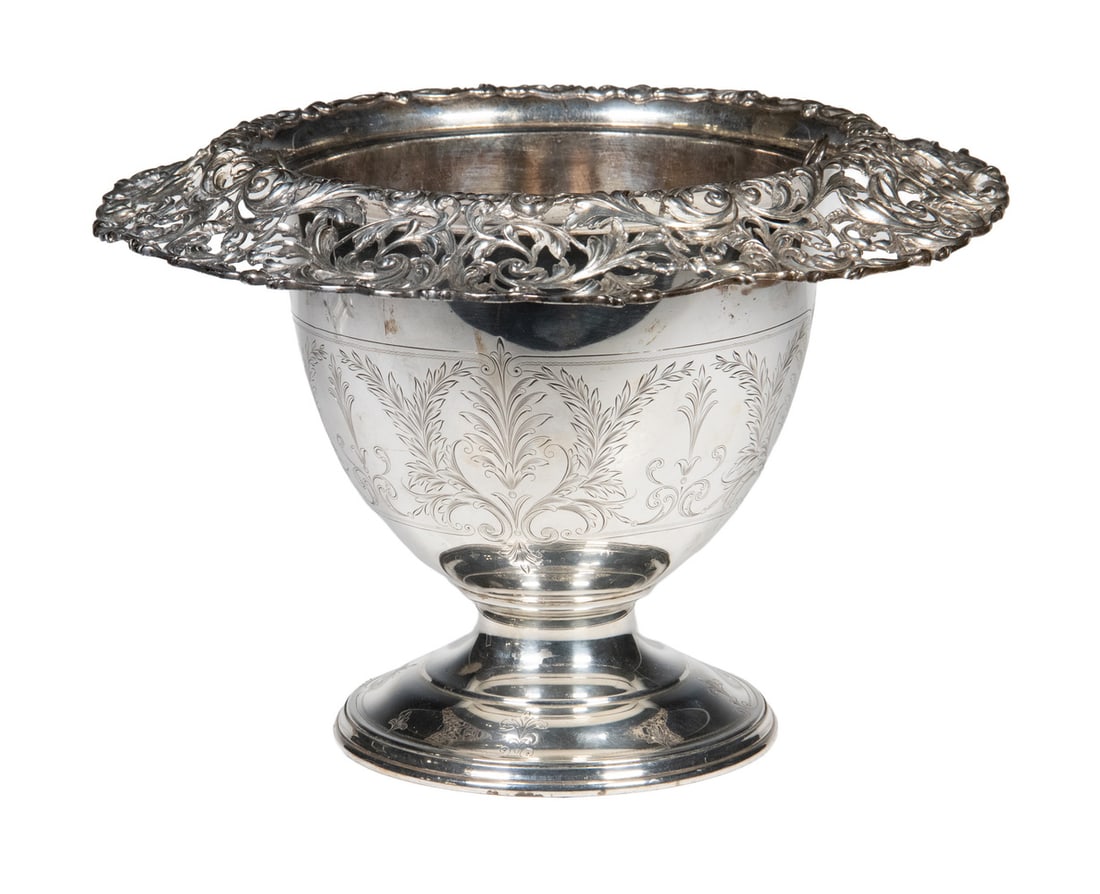 REED & BARTON STERLING SILVER WINE COOLER: Circa 1920s Beverage Cooler or Ice Bucket, by Reed & Barton (Taunton, MA), with flared and reticulated rim, feather and acanthus leaf engraved body, set on a domed foot, with silver-plate liner, the