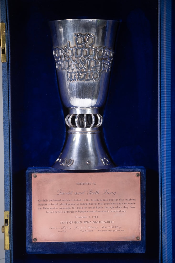 STERLING SILVER KIDDUSH CUP WITH PRESENTATION: Finely Crafted Mid-20th c. Hand Hammered Silver Wine Goblet, with gilt washed interior, cut-out stem and applied Hebrew letters, in custom velvet lined presentation case with plaque: "Presented to