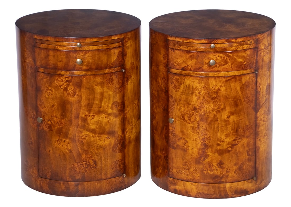 PR WILLIAM SWITZER CUSTOM BURLWOOD SIDE TABLES: Pair of Nicely Figured Drum Form Walnut Stands by William Switzer, each with pull-out shelf and drawer below, lower cabinet door opens to interior storage with single shelf insert.Each OS: 26 x 19