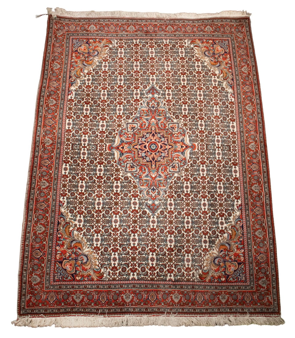 TABRIZ RUG (3'9" X 5'4"): From Northwest Persia, made in the last quarter of the 20th Century. Features a lobed circular medallion with matching pendants and spandrels in midnight blue, brick, sky blue and ivory on the ivory