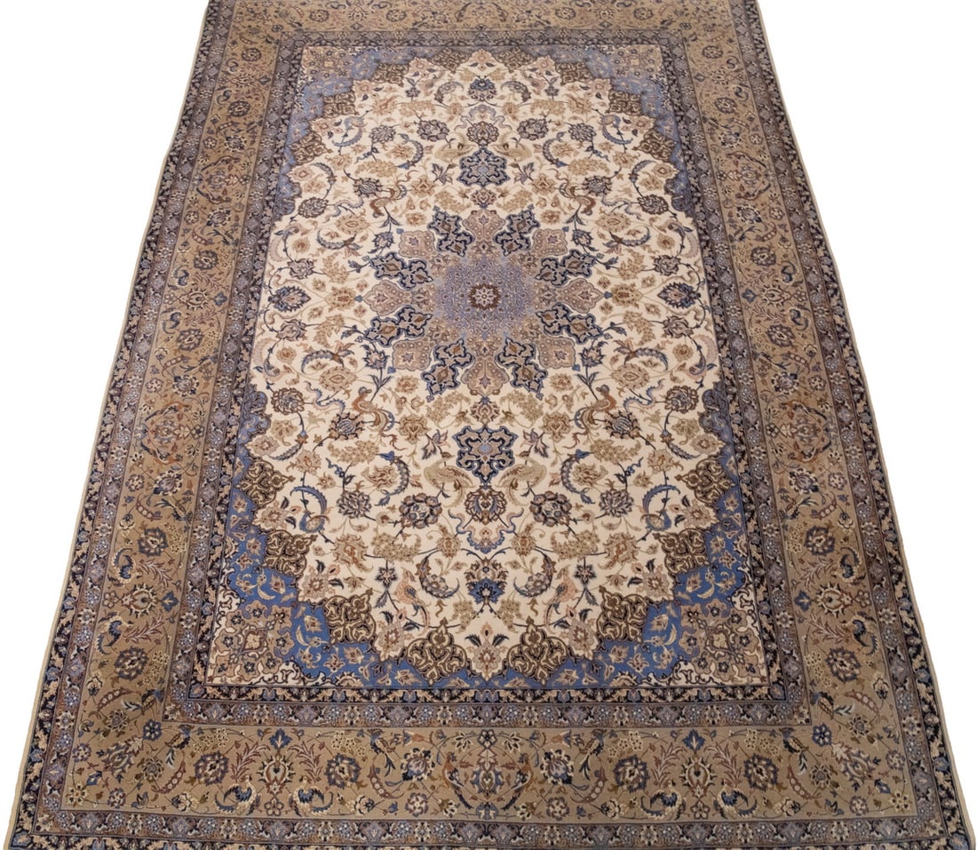 ISPHAHAN CARPET (6'7" X 10'2"): From Central Persia, made in the last quarter of the 20th Century. Features a rosette medallion with matching spandrels and pendants in midnight and sky blue, red, beige, rose and brown on the ivory
