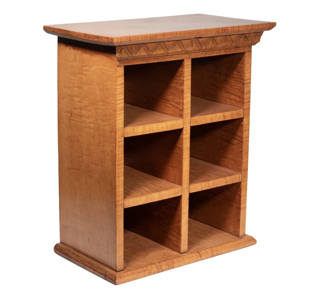 CUSTOM TIGER MAPLE CABINET: Finely Crafted Tabletop Cabinet, in figured maple, with six open compartments, having a molded edge cornice above incised frieze, on a molded edge base.OS: 23 x 11 1/2 x 20 in. (58.4 x 29.2 x 50.8