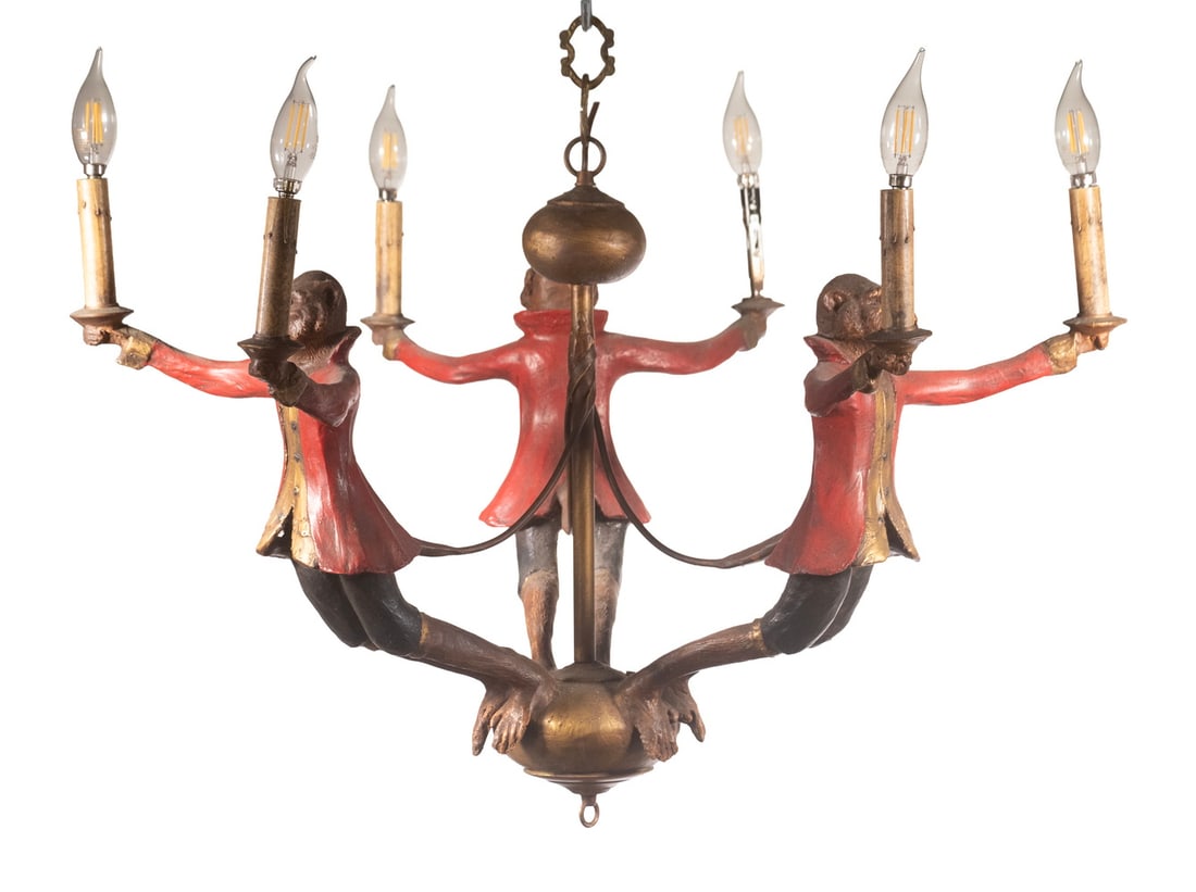BILL HUEBBE (US, 1929-2013) MONKEYS CHANDELIER: Charming Hanging Light Fixture, designed by American artist Bill Huebbe, in resin and metal, depicting three monkey figures in red jackets, each holding two candle form light sockets, suspended on a
