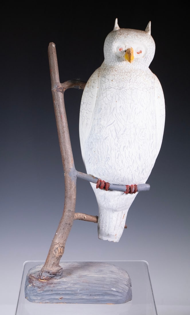 MAINE FOLK ART BIRD CARVING: Expressive Snowy Owl on Branch, carved and painted wood, unsigned, late 20th century.16.3 x 7 x 5 1/2 in. (41.5 x 17.8 x 14 cm.)