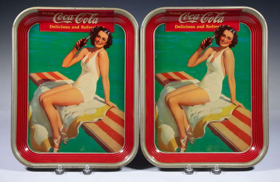 PR VINTAGE COCA COLA BATHING BEAUTY SERVING TRAYS: Pair of Circa 1939 Tin Lithographed Coca Cola Tray, signed by illustration artist Haddon Sundblom (IL/MI, 1899-1976), depicting a young girl in bathing suit seated on a diving board, also marked "The