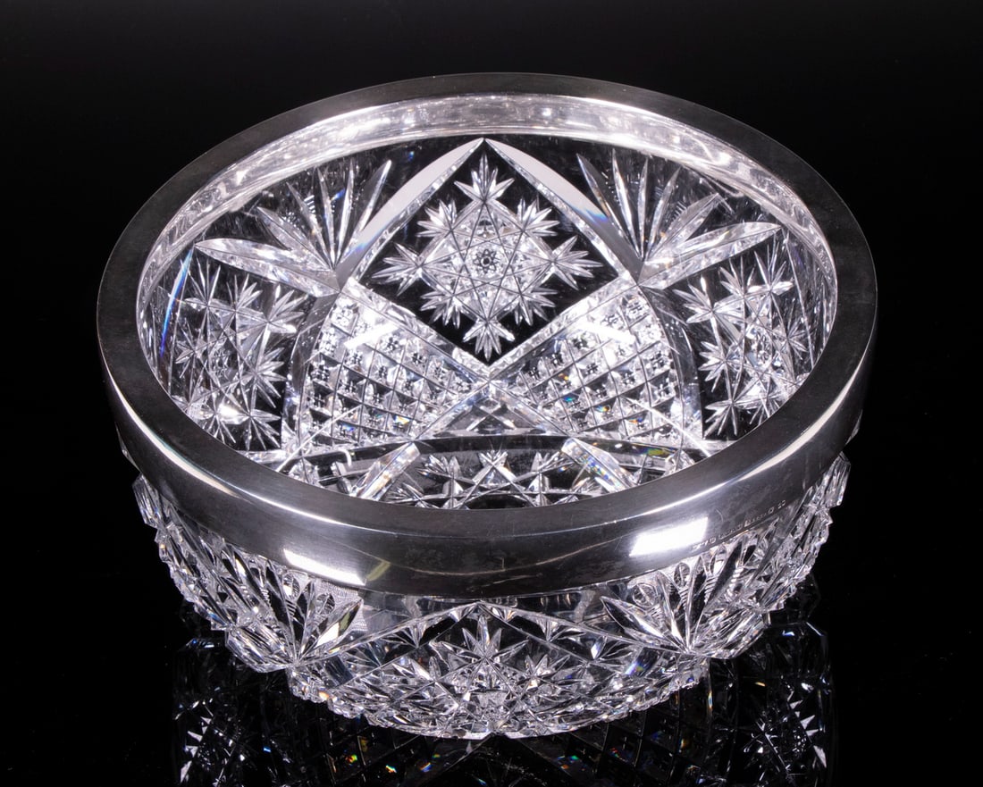 SILVER MOUNTED CUT GLASS BOWL: SILVER MOUNTED CUT GLASS BOWLEarly 20th c. German 800-Silver Rimmed Glass Bowl, silver by Heinrich Mau, Dresden, bowl cut from a clear, heavy blank.OS: 4 1/2 x 9 1/2 x 9 1/2 in. (11.4 x 24.1 x 24.1 cm