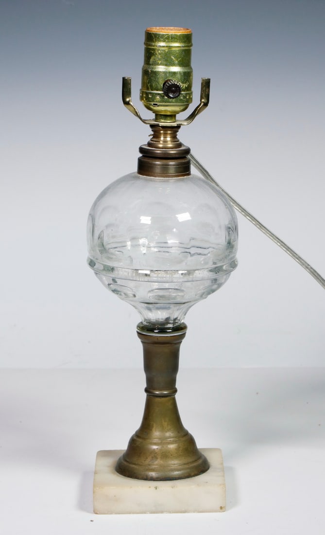 ELECTRIFIED VICTORIAN KEROSENE LAMP: ELECTRIFIED VICTORIAN KEROSENE LAMP19th c. Kerosene Lamp, with clear pattern glass spherical font and square white marble base, wired as a table lamp, single socket fixture with clip-on cutout paperbo
