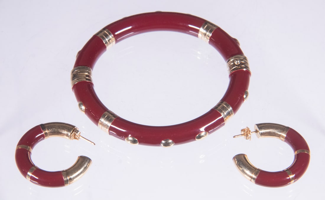 ITALIAN RED LACQUER BRACELET AND EARRINGS SET: ITALIAN RED LACQUER BRACELET AND EARRINGS SET(2) Piece Lot, incl: 14K yellow gold gilt sterling silver mounted hinged bangle bracelet, marked '925 14K GLDRM'; '585'. A Pair of hoop earrings with 14K g