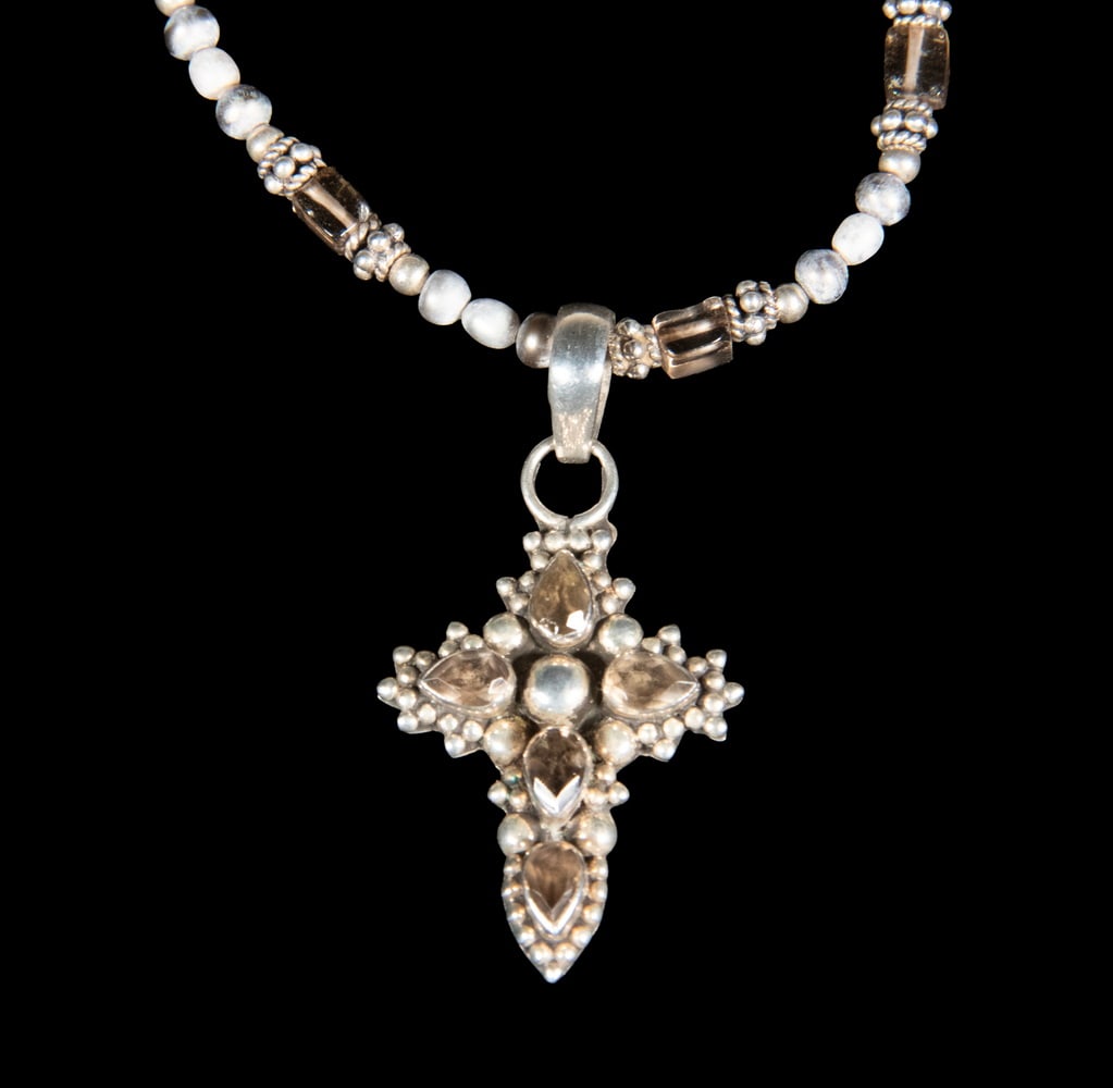 STERLING SILVER AND SMOKY QUARTZ CROSS PENDANT NECKLACE: STERLING SILVER AND SMOKY QUARTZ CROSS PENDANT NECKLACEA sterling silver necklace composed of small gray pearls and faceted smoky quartz spacers, suspending a cross-form pendant set with pear-shape fa