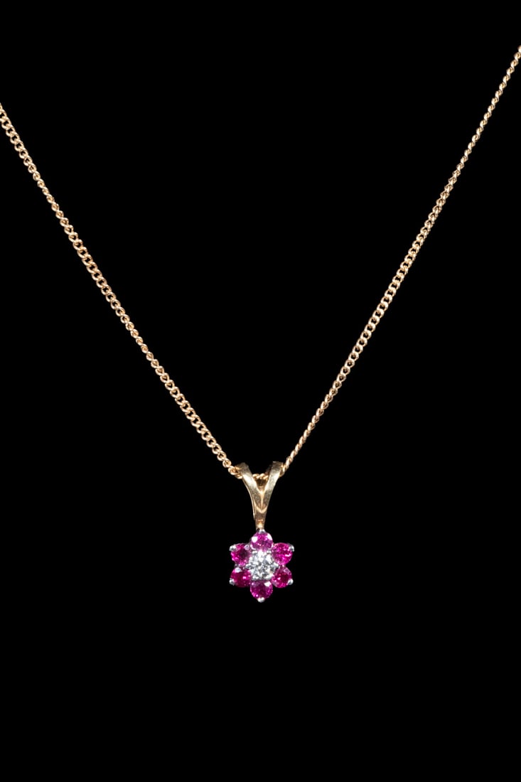 JABEL 18K GOLD, DIAMOND AND PINK SPINEL PENDANT NECKLACE: JABEL 18K GOLD, DIAMOND AND PINK SPINEL PENDANT NECKLACEA gold pendant necklace by JABEL, featuring a floral cluster pendant set with one round brilliant-cut diamond weighing approximately 0.10 ct at