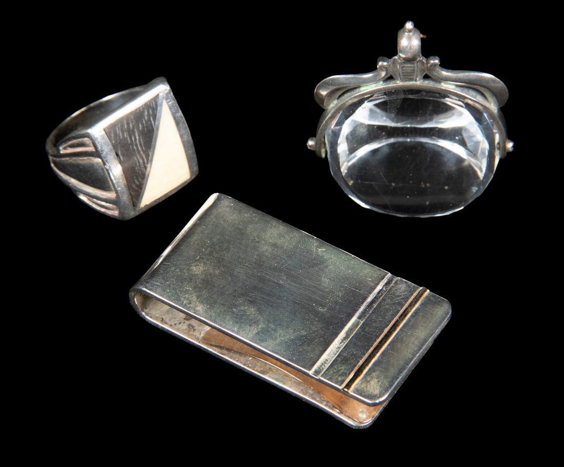 (3) PCS. STERLING SILVER JEWELRY AND ACCESSORIES: (3) PCS. STERLING SILVER JEWELRY AND ACCESSORIESA group of three silver accessories. Including a sterling silver money clip with applied 14K gold accent bands; a sterling silver ring set with geometri