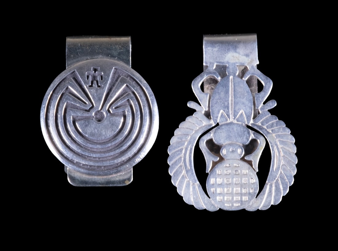 (2) SOUTHWESTERN STYLE SILVER MONEY CLIPS: (2) SOUTHWESTERN STYLE SILVER MONEY CLIPS Two silver money clips, one featuring a winged scarab motif, the other with a Man in the Maze design. 1.60 ozt. tw. LGST: 2 x 1 1/2 in. (5.1 x 3.8 cm.); SMST: