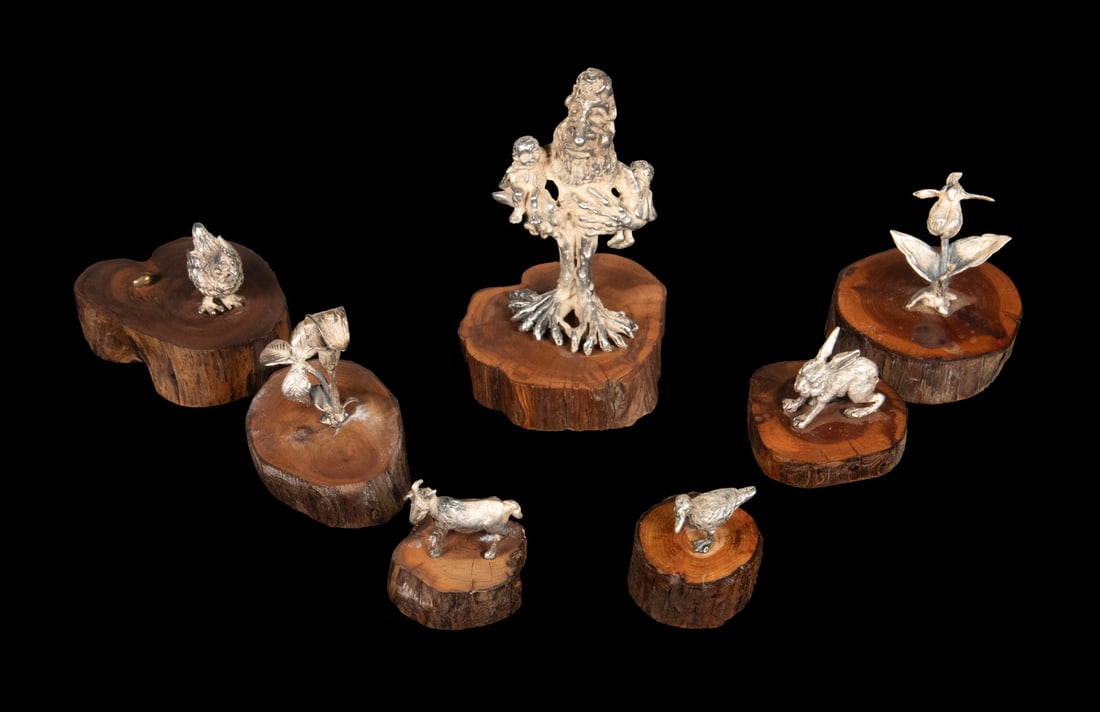 (7) BARBARA SCARPONI MINIATURE SILVER SCULPTURES: (7) BARBARA SCARPONI MINIATURE SILVER SCULPTURES Collection of (7) Sterling Silver Figural Sculptures, by the late New Hampshire artist Barbara Scarponi (1941-2018), all mounted on circular wooden