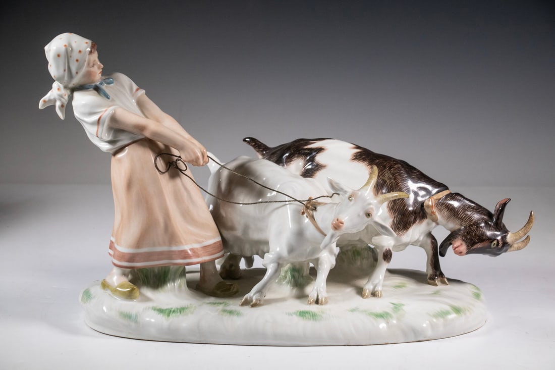 MEISSEN PORCELAIN FIGURAL GROUP AFTER OTTO PILZ: MEISSEN PORCELAIN FIGURAL GROUP AFTER OTTO PILZ Large Early 20th c. German Porcelain Figure, after a model by Otto Pilz (Germany, 1876-1934) depicting a young female herder pulling two goats, impresse