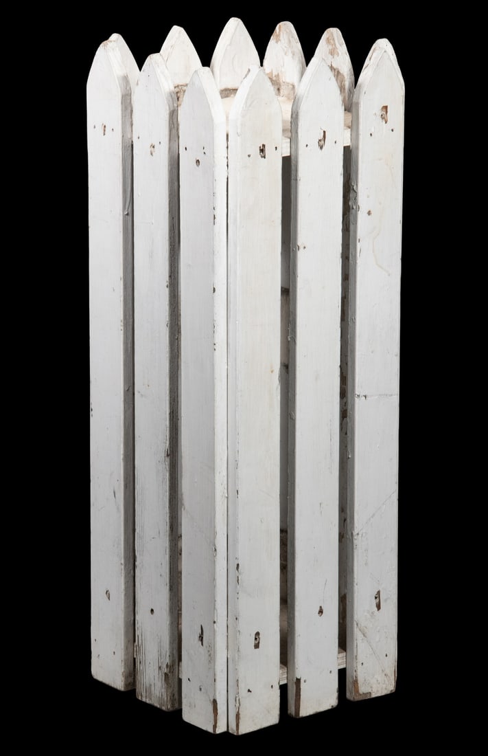 FOLK ART PICKET EDGE DISPLAY STAND: FOLK ART PICKET EDGE DISPLAY STAND Rustic White Painted Stand, with top display shelf surrounded by picket form stiles. OS: 30 x 11 x 11 in. (76.2 x 27.9 x 27.9 cm.)