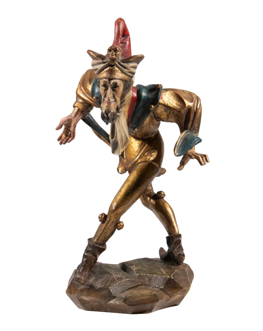 1950'S ITALIAN WOOD CARVING OF A JESTER: 1950'S ITALIAN WOOD CARVING OF A JESTER An Angular and Contorted Figure of a Taunting Jester, in gold with red, white and blue touches. OS: 15 x 9 x 6 1/2 in. (38.1 x 22.9 x 16.5 cm.)