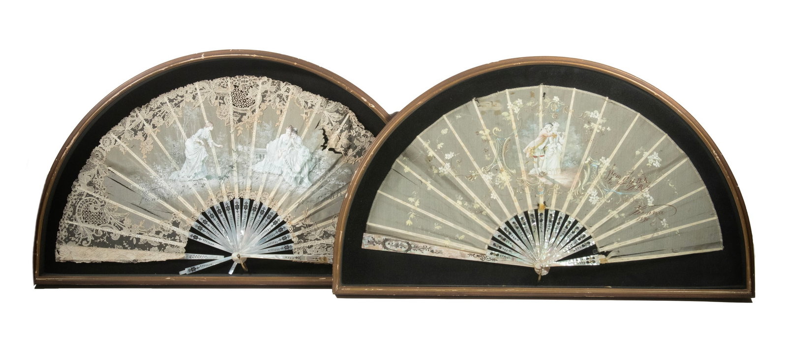 (2) FRAMED VIENNESE PAINTED LACE HAND FANS DATED 1890: (2) FRAMED VIENNESE PAINTED LACE HAND FANS DATED 1890 Both on mother-of-pearl frames, with inscriptions, made in Vienna in 1890, in matching black velvet box frames, one of a courting couple, the othe